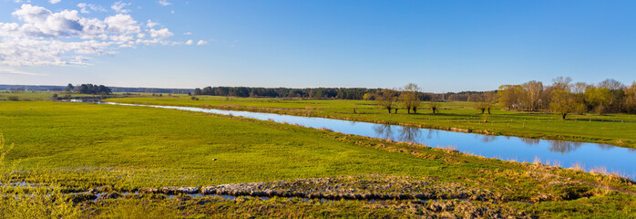 Early spring panoramic view of Narew river valley wetlands and nature reserve seen from Strekowa Gora village near Wizna in Podlaskie voivodship in Poland - obrazy, fototapety, plakaty