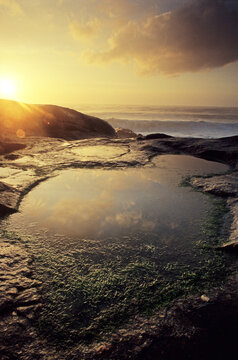 A small puddle formed by tides at sunset, Lavadores, Vila Nova de Gaia, Portugal.