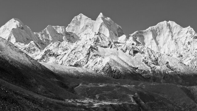 View of the high Himalayan peaks Kangtega (middle) and Thamserku (right) in the Khumbu Valley as seen from Pheriche. - Powered by Adobe