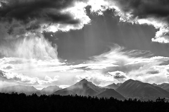 Late afternoon summer storms build and then move on over the Sangre de Cristo mountain range near Westcliffe, Colorado