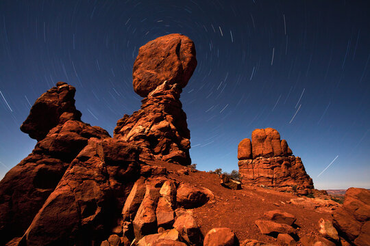Balanced Rock and star trails during a near full moon at Arches National Park.