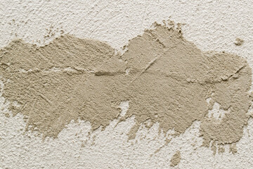 Concrete background. Plaster on the wall. Embossed textured surface.