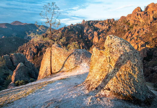 Landscape of the conglomerate stone and rolling hills from which it juts out in Pinnacles National Park, CA
