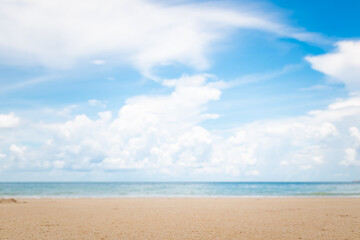 Fototapeta na wymiar Blurry tropical sea and beach with blue sky.
