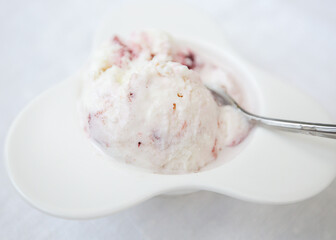 one white ball vanilla strawberry white plate spoon. Summer sweets, delicious treats, italian desserts, pamper yourself, dairy desserts concept.