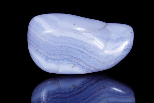 Macro mineral blue agate sapphirin in the rock on black background