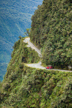 A 4x4 vehicle negotiates the convoluted Yungas mountain range near La Paz, Bolivia.