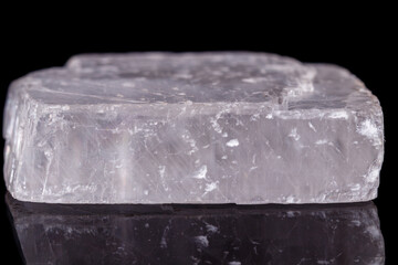 Macro mineral stone Iceland spar on black background