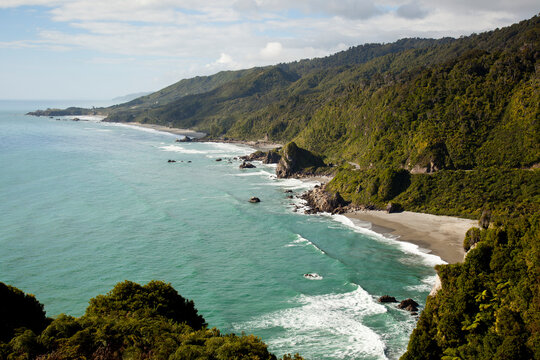 Surf crashes on a remote beach near Dolomite Point next to Highway 6 in New Zealand's South Island.