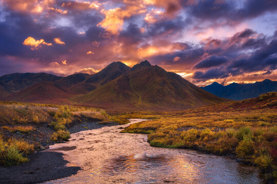 A small tributary of the Yukon River leading to epic sunset light in the foothills of the Tombstone Range, Yukon Territory.