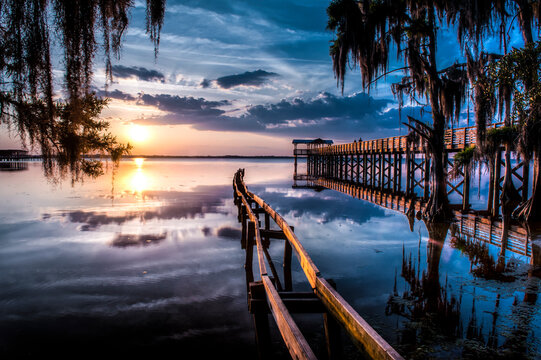 Jacksonville, FL: Sunset lights up the pier and canoe ramp