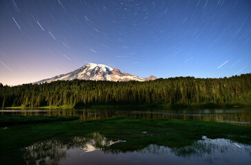 A partially moonlit night overlooking Reflection Lakes, Mount Rainier National Park, Washington.
