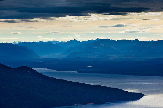 The sunrise above lake TeAnau as seen from the Kepler Trak in Fiordland National Park in New Zealand's South Island