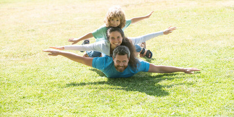 Family and child outdoors in spring nature. Banner panorama with copy space for text.
