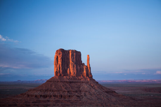 Sunset on the buttes at Monument Valley. One of the Mitten buttes and Merrick butte.