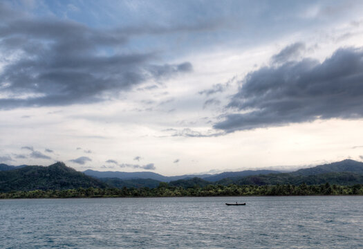 Traditional hollowed out wooden canoes being paddled by the Kuna, an indigenous people of the San Blas Islands.