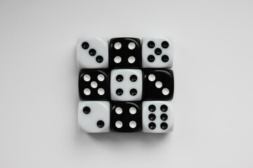 Black and white dice in various positions.