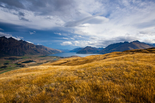The Remarkables and Eyre mountains rise sharply above Lake Wakatipu after a rainstorm as seen from Kelvin Heights near Queenstown, New Zealand's South Island.