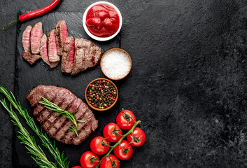 grilled beef steak on stone background with copy space for your text
