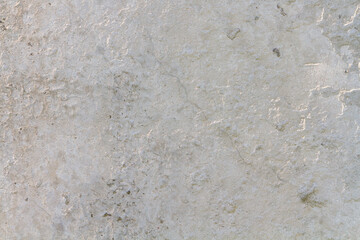 Abstract concrete background - in the form of a old rough scuffed wall, closeup