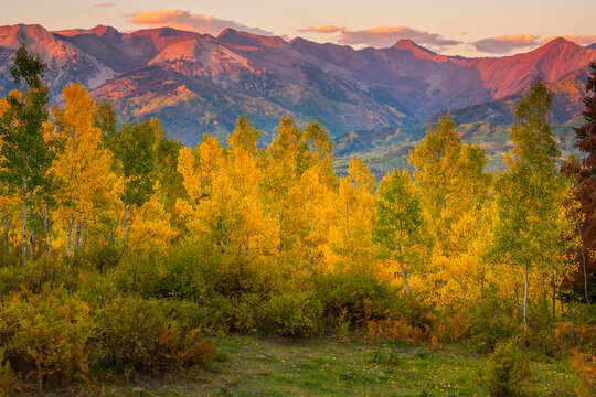 An autumn sunset over the mountains along Country Road 12 near Crested Butte, Colorado.