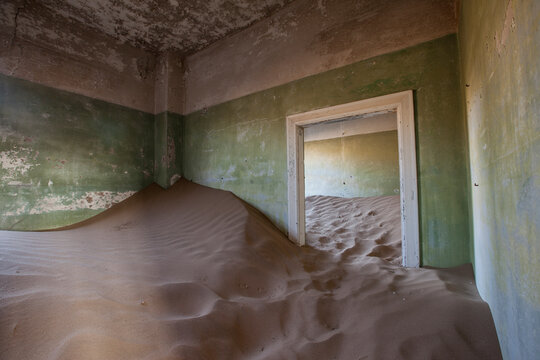 The Kolmanskop settlement where the diamond mine workers lived has been abandoned for over 60 years. Located just outside the city of Luderitz in Namibia.