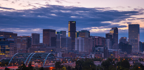 The skyline of Denver, CO at sunrise on a summer morning.