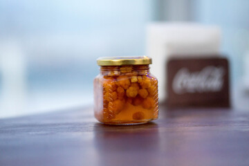 glass jar with cloudberry jam