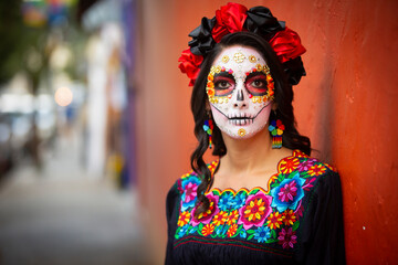 Woman's face with ceremonial make-up also known as Sugar skull, used in traditional Mexican Dia de los Muertos celebration