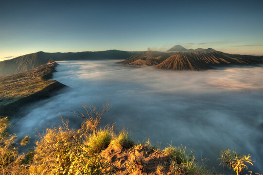 A sea of clouds covers the caldera at sunrise in Bromo-Tengger-Semeru National Park on the island of Java in Indonesia