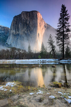 Morning mist fades from the base of El Capitan. Yosemite National Park, CA.