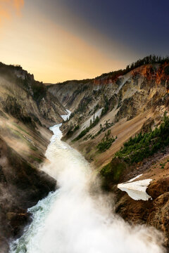 The lower falls of the Yellowstone River flows towards the Grand Canyon in Yellowstone National Park Wyoming.