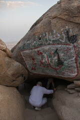 Ghar Thawr. Muslim pilgrims visiting Thawr Cave in Mecca - Saudi Arabia.