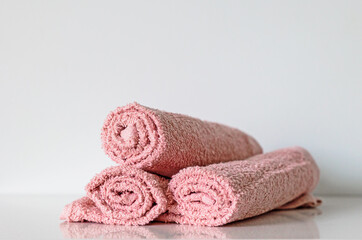 Fototapeta na wymiar pink bath towel rolls