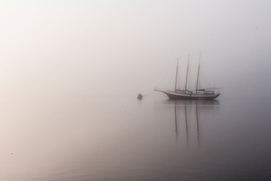St. Mary's, Georgia: A sailboat is moored on the river just outside the Cumberland National Seashore Ferry during a early foggy morning