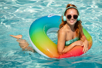 Woman on swim ring. Summer mood concept. Pool resort. Summertime days. Vacation, summer holiday.