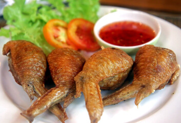 Fried chicken wings in a thai restaurant
