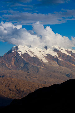 Mt. Illimani at sunset as seen from La Paz, Bolivia. The southernmost extension of the Cordillera Real is anchored by Mt. Illimani, the sentinel of La Paz.