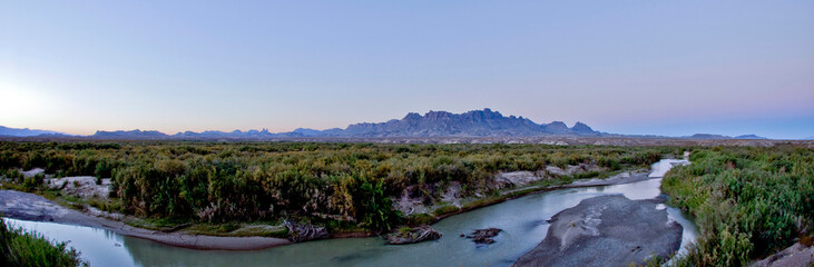 sunset over the chisos mountains and rio grande river panoramic, big bend national park, Texas
