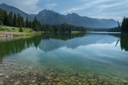 Two young boys try their luck at fishing in Johnson Lake, Banff National Park