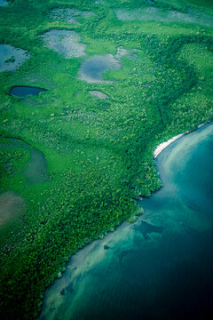 Aerial view of the jungles, beaches and farmland along the east coat of Belize.