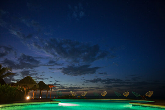 A sunset view from the pool deck at Villas Flamingos Hotel on Holbox Island, Mexico