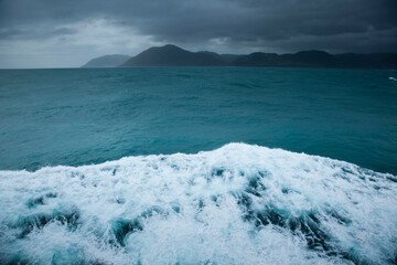Overcast skies, clouds and stormy weather in the Cook Strait of New Zealand during a ferry crossing from Wellington on the North Island to Picton on the South Island.
