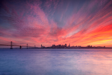 Colorful sunset over San Francisco Bay and the city skyline.