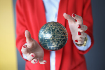 Ball in the air between the female hands.