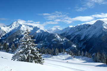 Fototapeta na wymiar Landscape at Penken ski resort in Zillertal in Tyrol. Austria in winter in Alps. Alpine mountains with snow. Blue sky and white slopes.