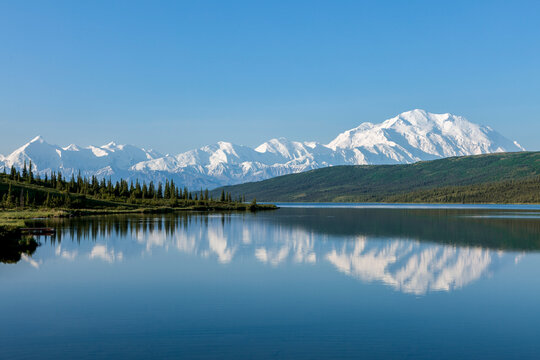 Massive Mount McKinley and the Alaska Range reflects in Wonder Lake on a calm summer morning in Denali National Park, Alaska