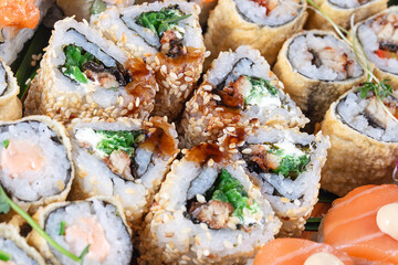 Triangular sushi or sesame rolls