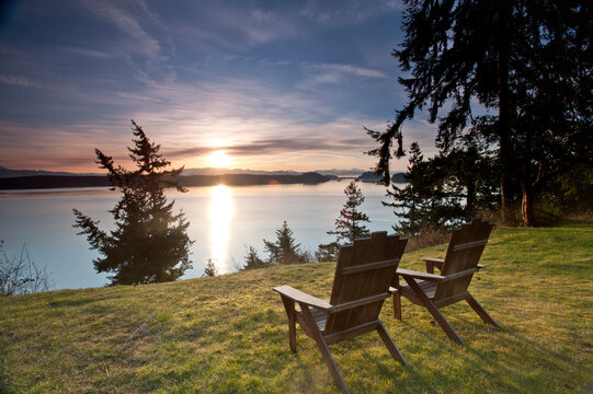 The sun rises behind the North Cascades from the Bluffs Bed and Breakfast, Whidbey Island, WA