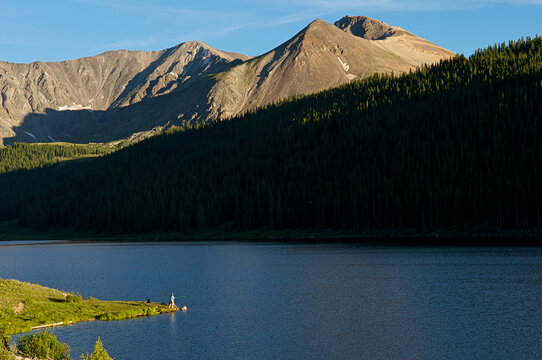 Laura Shultz fishing at Clinton Creek Lake near Leadville, CO.
